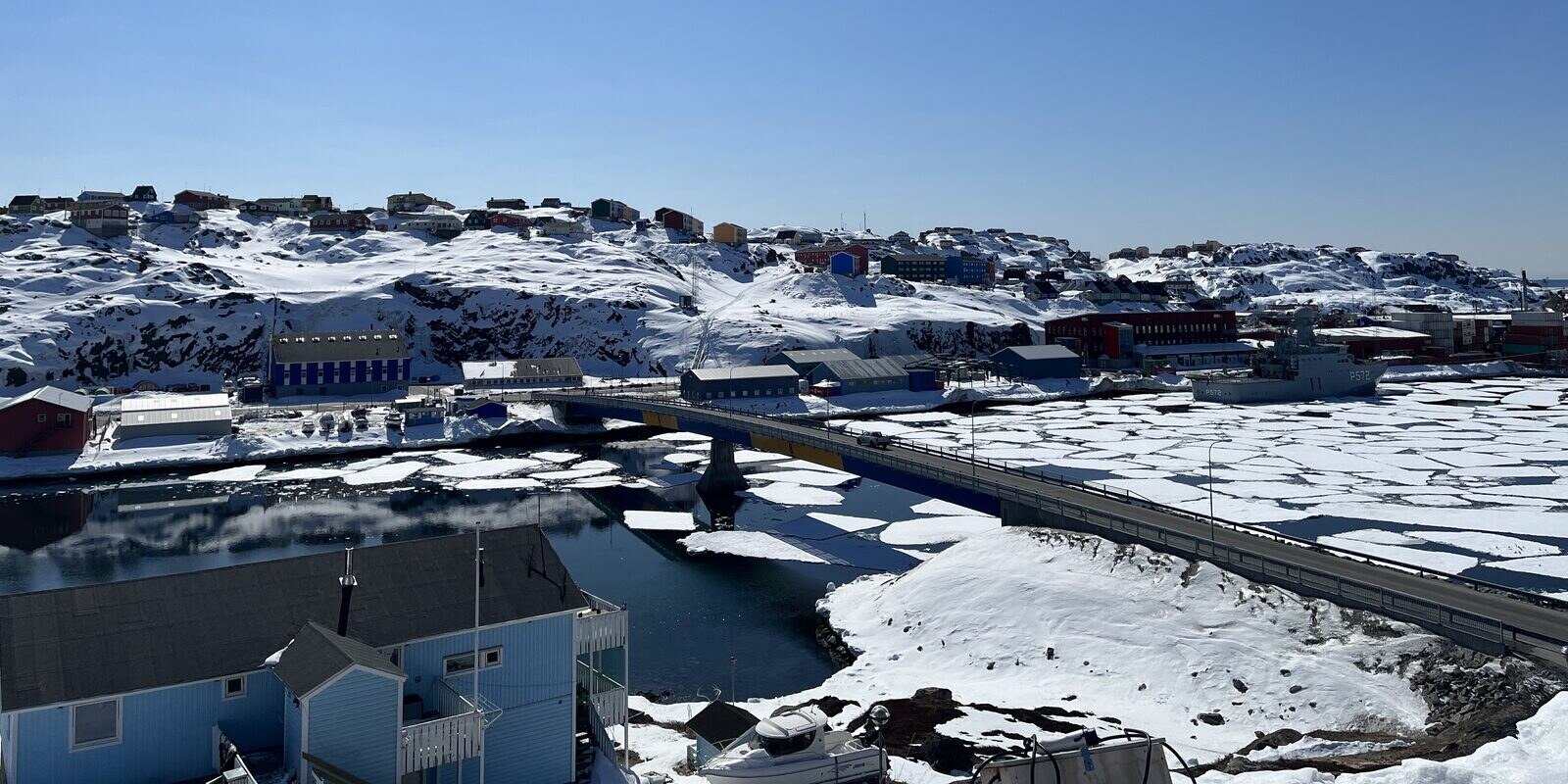 Sisimiut town and harbour with drifting sea ice, April 2024.